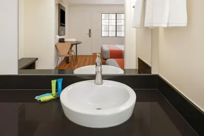 a bathroom with a white sink in a room at Motel 6-Thousand Oaks, CA in Thousand Oaks