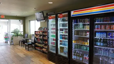 a store with two large refrigerators and drinks at Hawthorne Plaza Inn Near LAX in Hawthorne