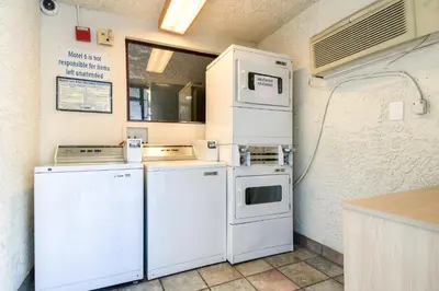 a kitchen with refrigerators and appliances in a room at Motel 6-Pomona, CA - Los Angeles in Pomona
