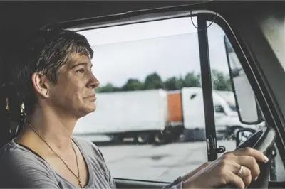a man sitting in a truck looking out the window at Studio 6 Bakersfield, CA South in Bakersfield