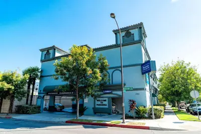 a blue building on the corner of a street at Rodeway Inn & Suites Pasadena in Pasadena