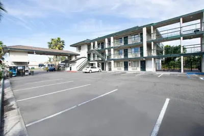 an empty parking lot in front of a building at Morada Inn in Anaheim