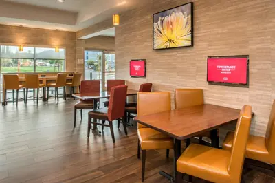 a dining room with tables and chairs in a restaurant at TownePlace Suites by Marriott San Bernardino Loma Linda in Loma Linda