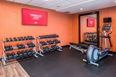 a fitness room with several rows of exercise equipment at TownePlace Suites by Marriott San Bernardino Loma Linda in Loma Linda
