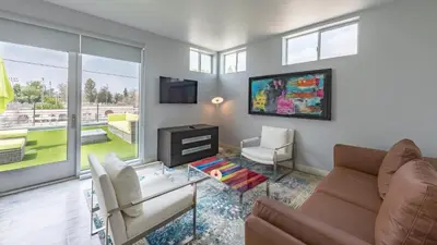 a living room with a couch and a tv at Lexen Hotel - North Hollywood Near Universal Studios in North Hollywood