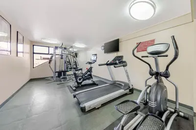 a gym with two treadmills and two exercise bikes at Best Western Plus Heritage Inn Ontario Rancho Cucamonga in Rancho Cucamonga