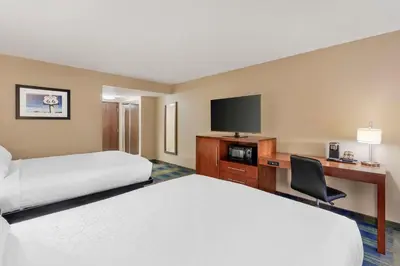 a hotel room with two beds and a flat screen tv at Best Western Plus Heritage Inn Ontario Rancho Cucamonga in Rancho Cucamonga