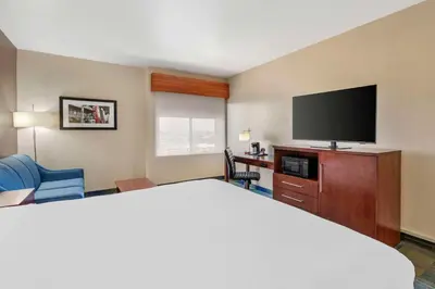 a hotel room with a bed and a flat screen tv at Best Western Plus Heritage Inn Ontario Rancho Cucamonga in Rancho Cucamonga