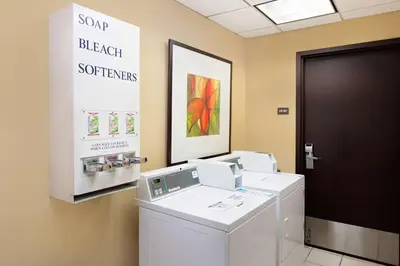 a laundry room with a washer and dryer at Hyatt Place Ontario/Rancho Cucamonga in Ontario