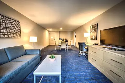 a living room with a couch and a flat screen tv at Best Western Plus Media Center Inn & Suites in Burbank
