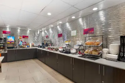 a buffet line in a store with aasteryasteryasteryasteryasteryasteryasteryastery at Best Western Plus Commerce Hotel in Los Angeles