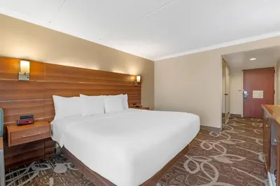 a large white bed in a hotel room at Comfort Inn Anaheim Resort in Anaheim