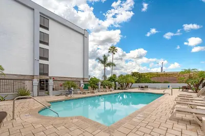 a swimming pool in front of a building at Comfort Inn Anaheim Resort in Anaheim