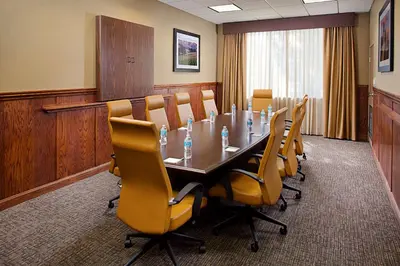 a conference room with a long table and chairs at Hampton Inn & Suites Palmdale in Palmdale