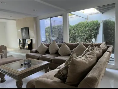 a living room with a couch and a coffee table at Beautiful 4BD and 3BA Pool Jacuzzi Vacation Home in Los Angeles