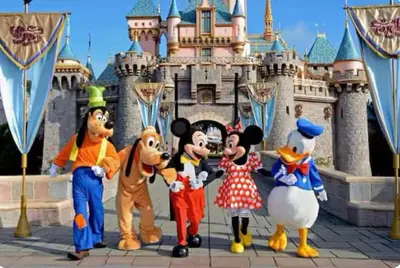 a group of mickeys in front of a disney castle at Beautiful 4BD and 3BA Pool Jacuzzi Vacation Home in Los Angeles