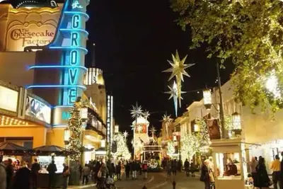 a group of people walking down a street with christmas lights at Beautiful 4BD and 3BA Pool Jacuzzi Vacation Home in Los Angeles