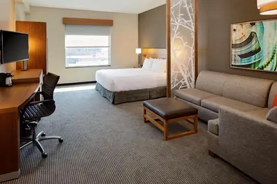 a hotel room with a bed and a desk at Hyatt Place Glendale/Los Angeles in Glendale