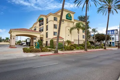 a building with a clock on it on a street at La Quinta by Wyndham NE Long Beach/Cypress in Hawaiian Gardens
