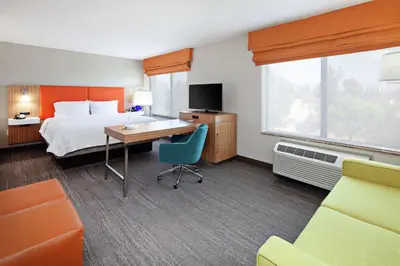 a hotel room with a bed and a desk at Hampton Inn & Suites Chino Hills in Chino Hills