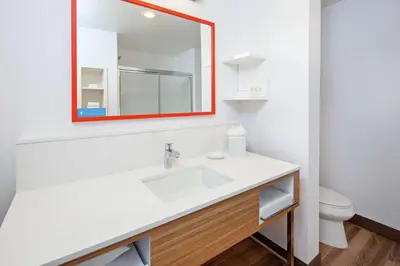 a bathroom with a white sink and a mirror at Hampton Inn & Suites Chino Hills in Chino Hills
