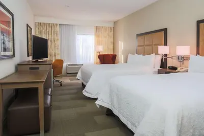 a hotel room with two beds and a television at Hampton Inn & Suites Camarillo in Camarillo