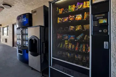 a vending machine in a building with food and drinks at Rodeway Inn San Bernardino - Colton in San Bernardino