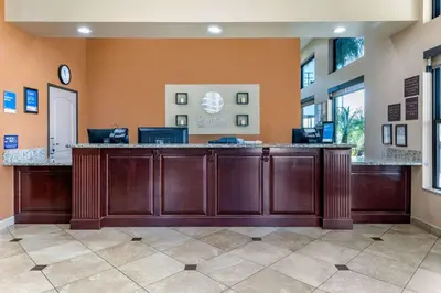 a lobby with a reception desk in a building at Comfort Inn & Suites Colton - San Bernardino in Colton