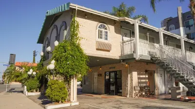 a building with a staircase on the side of it at 777 Motor Inn in Sherman Oaks