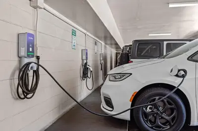 a car is being charged in a parking garage at Del Sol Inn Anaheim in Anaheim
