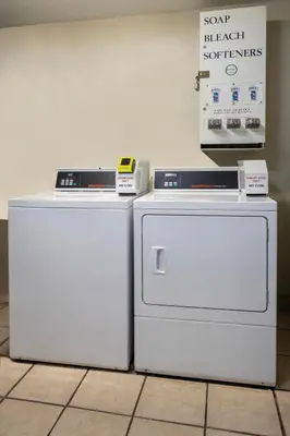 two refrigerators sitting next to each other on a floor at Del Sol Inn Anaheim in Anaheim