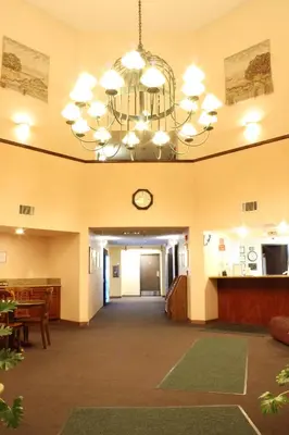 a large lobby with a clock on the ceiling at Ocean Gateway Inn in Santa Paula