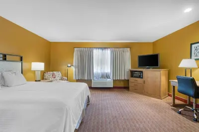 a hotel room with a bed and a flat screen tv at SureStay Hotel by Best Western Camarillo in Camarillo