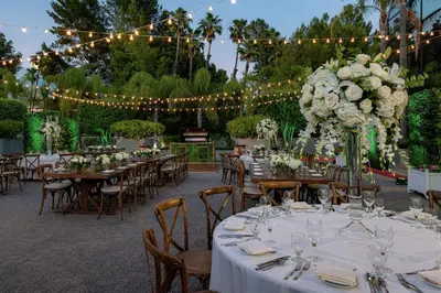 a wedding reception with tables and chairs and lights at Hilton Los Angeles-Universal City in Los Angeles