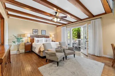 a bedroom with a bed and a ceiling fan at Channel Road Inn, A Four Sisters Inn in Los Angeles