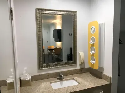 a bathroom with a sink and a mirror at Motel 6-Norwalk, CA in Norwalk