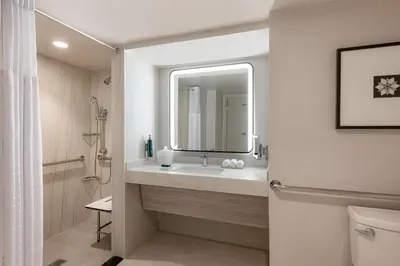 a bathroom with a sink and a mirror at Hilton Los Angeles Airport in Los Angeles