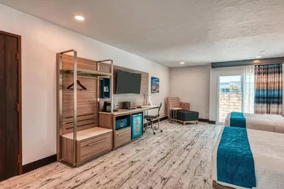 a hotel room with a bed and a desk at Casa Via Mar Inn, an Ascend Collection Hotel in Port Hueneme