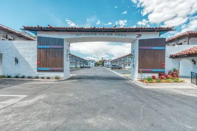 an empty street in a town with an archway at Casa Via Mar Inn, an Ascend Collection Hotel in Port Hueneme
