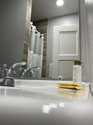 a bathroom counter with a sink and a mirror at Howard Johnson by Wyndham Ridgecrest, CA in Ridgecrest