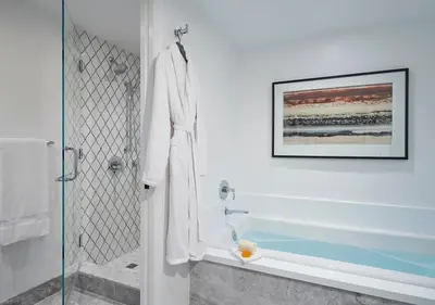 a bathroom with a shower with a glass door at Ojai Valley Inn in Ojai