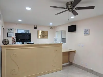 a cash counter with a ceiling fan in a salon at Americas Best Value Inn Thousand Oaks in Thousand Oaks