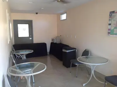 a waiting room with two tables and a couch at Americas Best Value Inn Thousand Oaks in Thousand Oaks