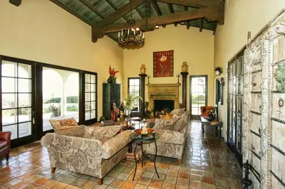 a large living room with couches and a fireplace at The Patrician Hollywood Universal in Pasadena
