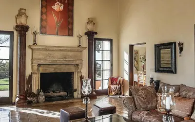a living room with a fireplace and a couch at The Patrician Hollywood Universal in Pasadena