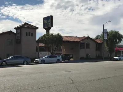 a sign for a fast food restaurant with parked cars at Best Inn Rosemead in Rosemead