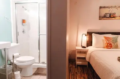 a bathroom with a bed and a toilet and a shower at Samesun Venice Beach Hotel & Hostel in Los Angeles