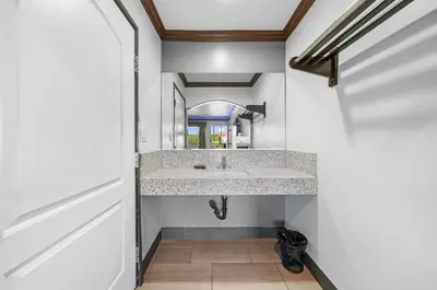 a bathroom with a sink and a mirror at Starlight Inn South El Monte in South El Monte