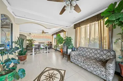 a living room with a couch and lots of plants at Starlight Inn South El Monte in South El Monte