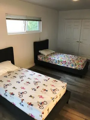 a room with two beds in a room at 4 bedroom and 3 bath home close to universal studio and Hollywood in Sherman Oaks